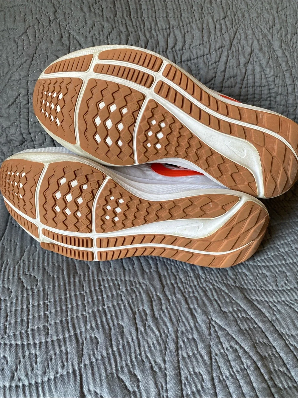 Nike White Running Shoes with Orange Swoosh and Leopard Accents